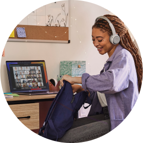 A student uses a Cisco headset for Webex Meetings.